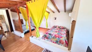 Postel nebo postele na pokoji v ubytování Citron vert