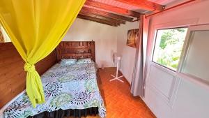 Postel nebo postele na pokoji v ubytování Citron vert