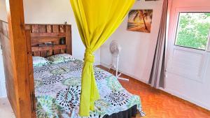 Postel nebo postele na pokoji v ubytování Citron vert