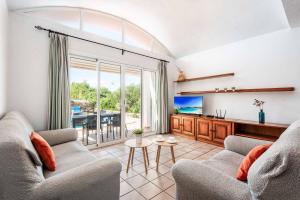 TV a/nebo společenská místnost v ubytování Villa Laura 245