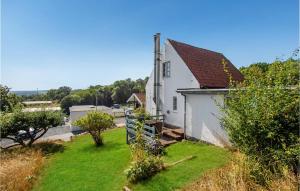 an image of a white house with a yard at 3 Bedroom Gorgeous Home In Allinge in Allinge