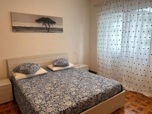 Postel nebo postele na pokoji v ubytování Melide lake apartment