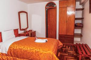 Postel nebo postele na pokoji v ubytování Inkas Peru Hostal