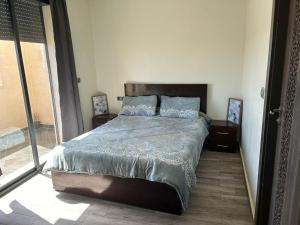 Postel nebo postele na pokoji v ubytování Appartement à Sidi Rahal - 5 min de la plage