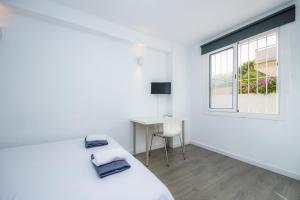 Mallorca Rooms Can Pastilla客房内的一张或多张床位