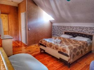 Postel nebo postele na pokoji v ubytování Garden F Sheki