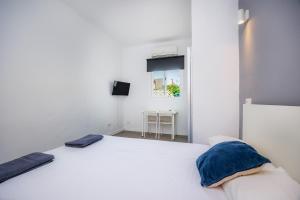 Mallorca Rooms Can Pastilla客房内的一张或多张床位