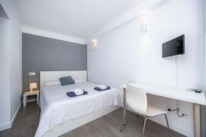 Mallorca Rooms Can Pastilla客房内的一张或多张床位
