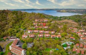 an aerial view of a house on a hill with a lake at Ocean and Mountain View Villa in Playa Hermosa