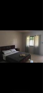 Postel nebo postele na pokoji v ubytování KJT Travellers Inn