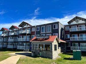 a large apartment building with red roof at ML286 Beautiful Views New Deck WiFi EZ Parking in Snowshoe