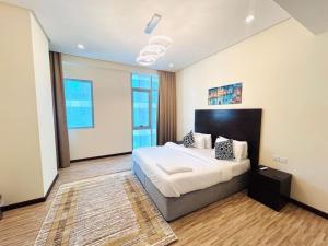a bedroom with a large bed in a room at Aspire Tower # Peaceful Pad Juffair in Manama +21 photos