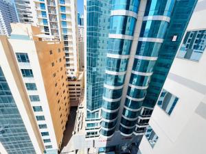 a view of a tall building in a city at Aspire Tower # Peaceful Pad Juffair in Manama