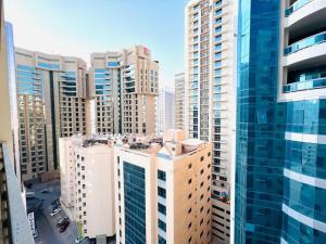 an aerial view of a city with tall buildings at Aspire Tower-The Tranquil Haven in Manama
