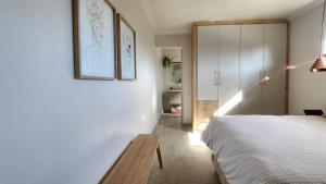 a bedroom with a bed and a table in it at Executive Suites Brackenhurst in Alberton
