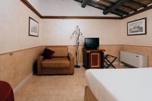TV a/nebo společenská místnost v ubytování Hotel Pantheon