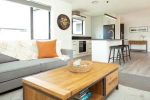 a living room with a couch and a table at Family Friendly on Forest Drive in Methven