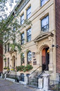 a building with a staircase in front of it at Luxury Brownstone - Walk to ALL - Washington Park in Cincinnati