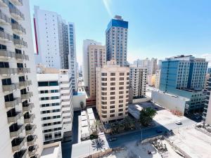 an aerial view of a city with tall buildings at Aspire Tower -Chic City Escape Juffair in Manama