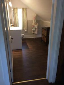 a bathroom with a sink and a toilet in a room at Charming Farmhouse in the City, Near Wine Country in Belleville +20 photos