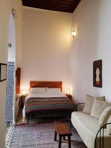 Postel nebo postele na pokoji v ubytování Riad Inspira
