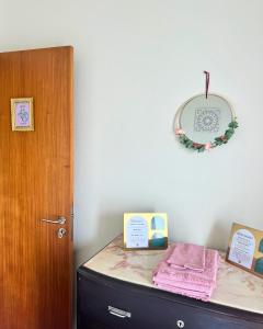 a room with a dresser with a mirror on the wall at Vagabond Mermaid Guesthouse in Ponta Delgada