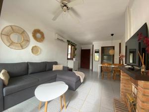 a living room with a couch and a table at Beach Appartement Denia in Denia