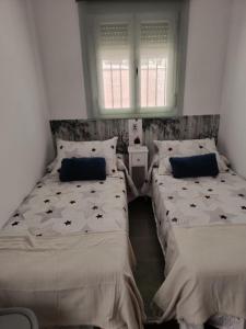 Postel nebo postele na pokoji v ubytování casas del monte 1