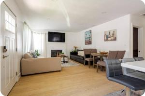 a living room with a couch and a table at The Heart Of LA House in Los Angeles