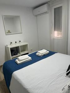 La Vida es Bella Córdoba房間的床