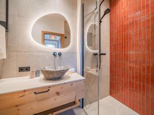 a bathroom with a bowl sink and a shower at Premium Apartment Sunnseit in Hollersbach im Pinzgau +18 photos