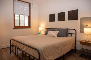 a bedroom with a bed and a window at City Hall Clerk's Office in Rochester
