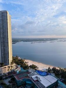 an aerial view of a building and a beach at Muji Full Seaview Royal Strand with 2CarParks FOC Netflix Access and Youtube Premium 3Beds 3Bath for 6-12pax by Minshuku in Johor Bahru