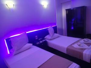 Postel nebo postele na pokoji v ubytování Abo Elwafa Hotel