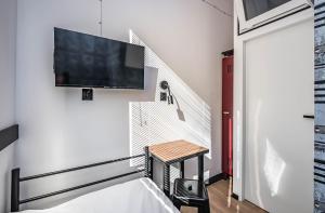 TV a/nebo společenská místnost v ubytování Vola Hostel