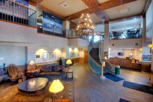 a large lobby with a staircase and a living room at Kirkwood Mountain Resort Properties in Kirkwood