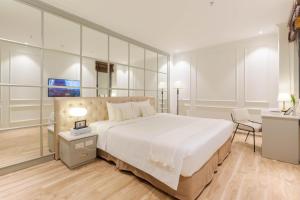 Voodi või voodid majutusasutuse Keypad Hotel - Nhân Hòa toas