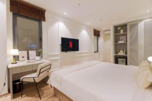 Voodi või voodid majutusasutuse Keypad Hotel - Nhân Hòa toas