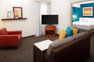 a hotel room with a couch and a bed at Residence Inn Harrisburg Hershey in Harrisburg +26 photos