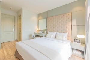 Voodi või voodid majutusasutuse Keypad Hotel - Nhân Hòa toas