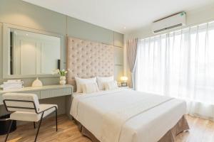 Voodi või voodid majutusasutuse Keypad Hotel - Nhân Hòa toas