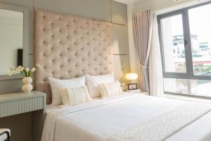 Voodi või voodid majutusasutuse Keypad Hotel - Nhân Hòa toas