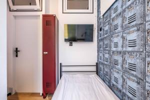TV a/nebo společenská místnost v ubytování Vola Hostel