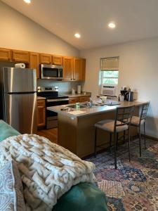 a kitchen with a stainless steel refrigerator and a counter at Close to the Bozeman airport in Belgrade