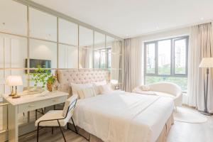 Postel nebo postele na pokoji v ubytování Keypad Hotel - Nhân Hòa