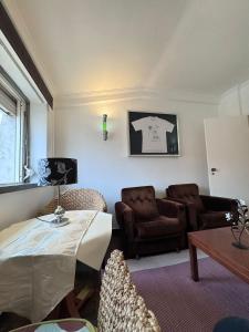 a living room with a couch and a table at The Pearl - Cascais Guest House - City & Beach in Cascais
