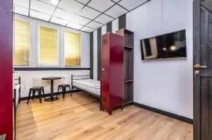 TV a/nebo společenská místnost v ubytování Vola Hostel