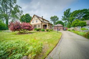 a house with a yard with a driveway at Central Erie Vacation Rental about 2 Mi to Beach! in Erie
