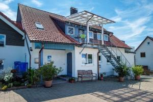a house with a staircase on top of it at Ferienwohnungen Tanja Schoch in Lindau