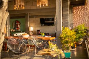 a kitchen with a table and chairs in a room at Casa Playa Puerto luz in Santa Marta
